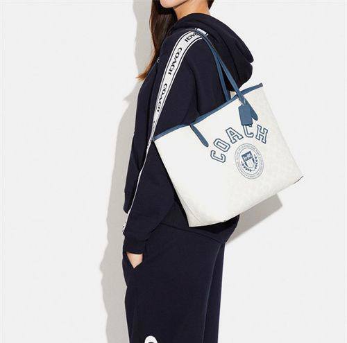 Coach City Tote In Signature Canvas With Varsity Motif